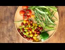 A mix of colorful vegetables in a simple container.田中鉄也オンド.com
