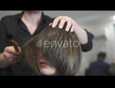 Woman Getting a Haircut in a Hair Salon