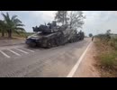 Oplot-T tank driving up onto a truck platform for transport back to base