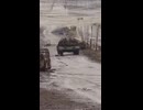 A Ukrainian tank races along with soldiers on its armor, heading to Kostiantynivka.