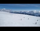 Majestic Aerial View of Skiers on Snowy Mountain