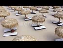 Aerial view of beach umbrellas and sunbeds on sand beach