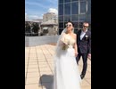 A Ukrainian couple celebrates their wedding in Zaporizhzhia as burning Russian Shahed drones fall